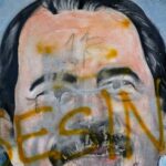 FILE - The Spanish word for "Murderer" covers a mural of Nicaragua's President Daniel Ortega, as part of anti-government protests demanding his resignation in Managua, Nicaragua, May 26, 2018. Four months before scheduled 2022 municipal elections, Ni