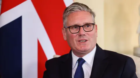 PA Keir Starmer frente a la bandera Union Jack